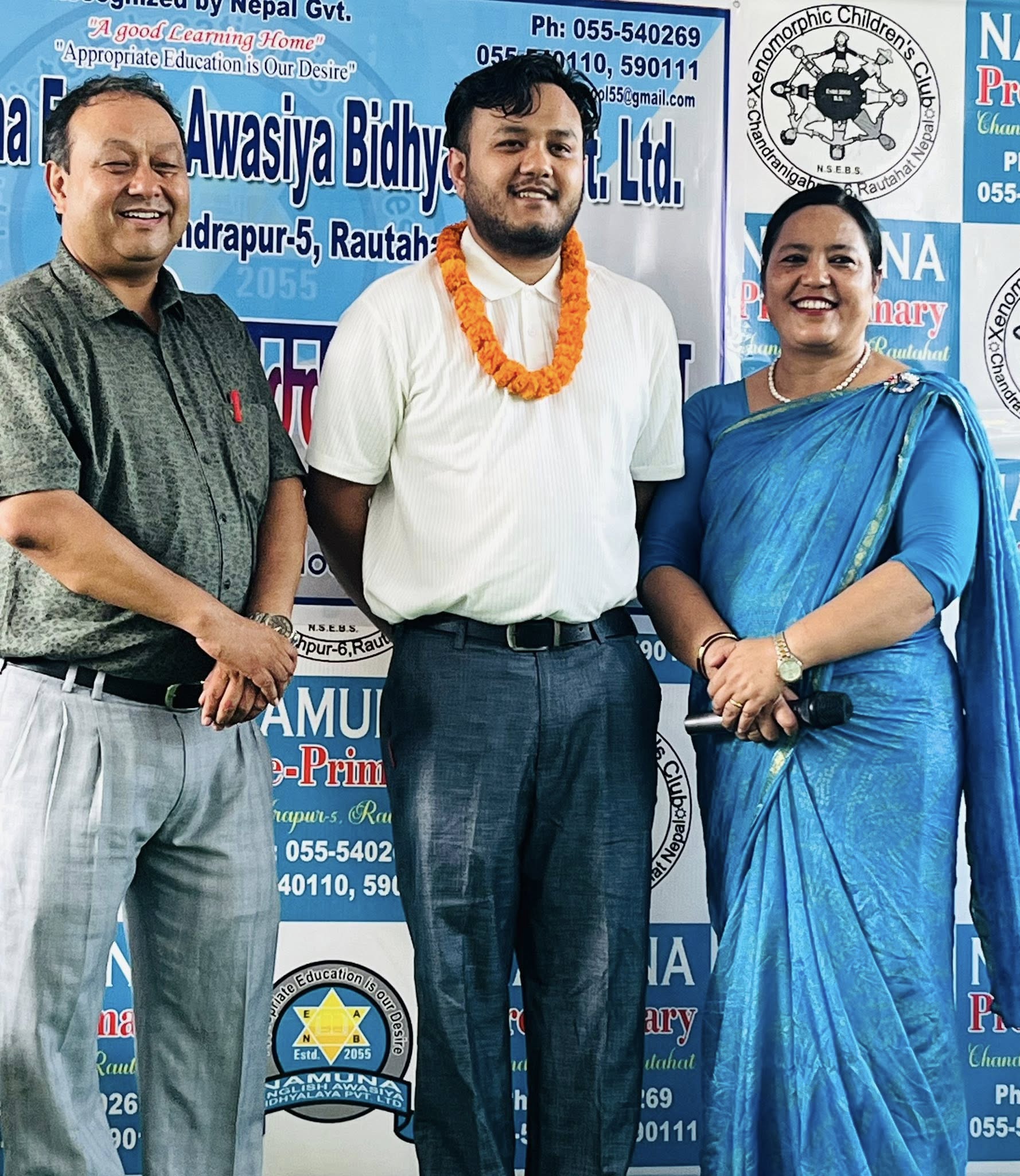 Teacher being honoured with certificate at Namuna English Awasiya Bidhyalaya